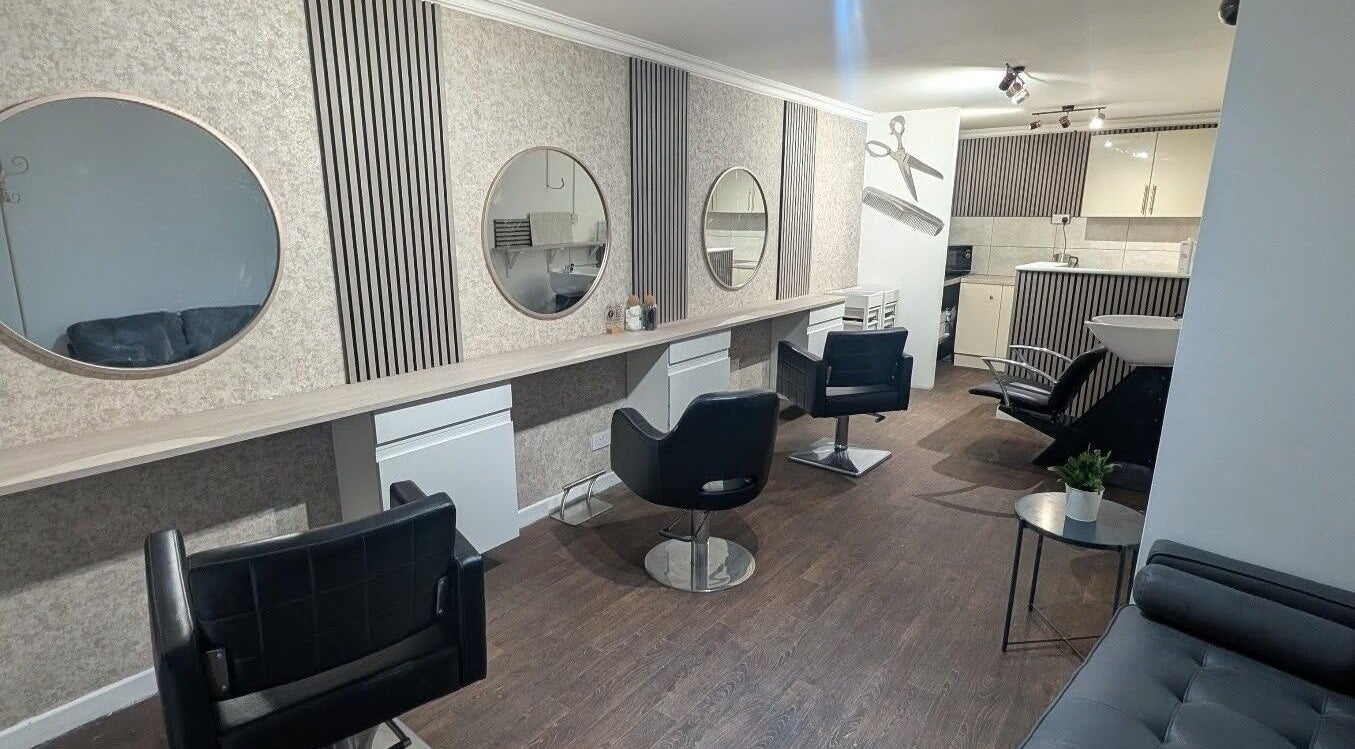 Contemporary interior of Amara's Hair Lounge in Exning, England, GB showcasing stylish salon chairs and mirrors.