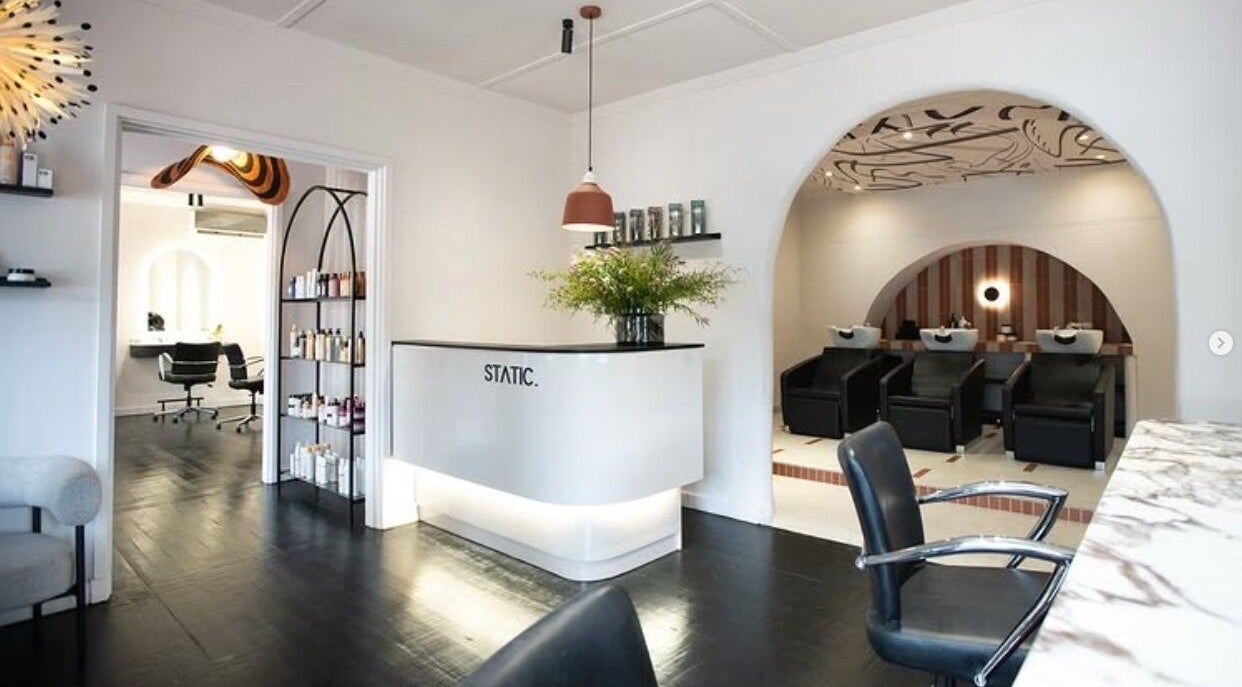 Interior of STATIC Dry Bar in Durban North, Kwazulu-natal, ZA with sleek salon stations and modern decor.