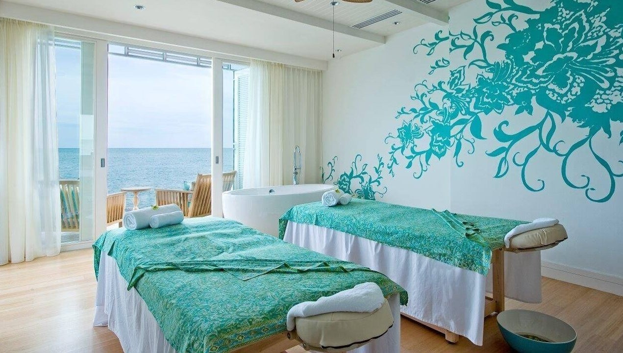 Relaxing massage room at aVi Spa, Port Dickson, Negeri Sembilan, MY overlooking the ocean with calming decor.