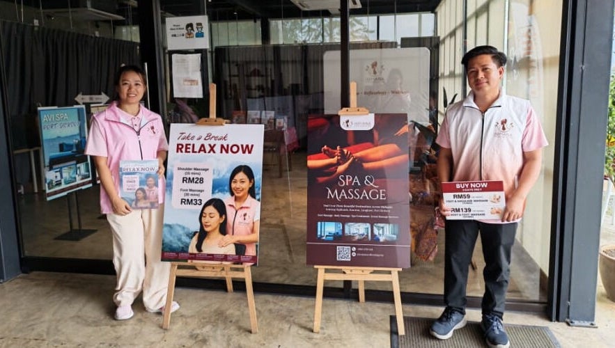 Staff in front of Excellent Song Yan, Bentong, Pahang, MY offering spa and massage services.