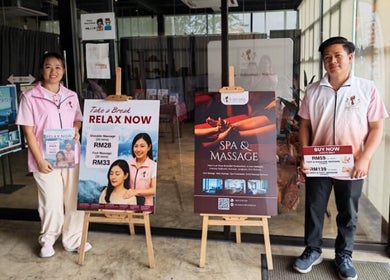 Staff in front of Excellent Song Yan, Bentong, Pahang, MY offering spa and massage services.