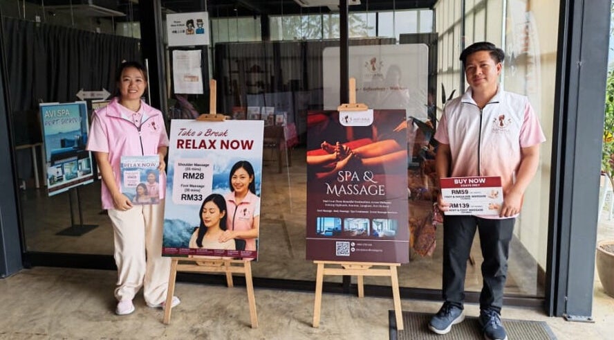 Staff in front of Excellent Song Yan, Bentong, Pahang, MY offering spa and massage services.