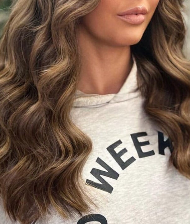 Elegant brunette waves styled at De La Mare, North Lanarkshire, UK, GB.