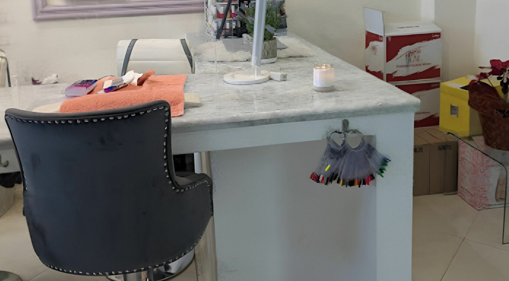 Chic nail station at Tip Sip Nails Bar, Montego Bay, St. James Parish, JM, with elegant chair and decor.