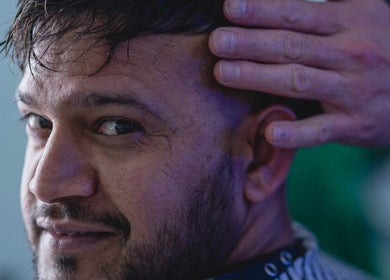 Man receiving hair styling at BROOKS Hair Tailoring, Watford, England, GB.