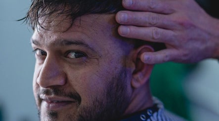 Man receiving hair styling at BROOKS Hair Tailoring, Watford, England, GB.