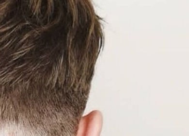 Close-up of a stylish men's haircut at BROOKS Hair Tailoring, Watford, England, GB.