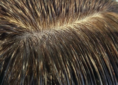 Close-up of styled hair at BROOKS Hair Tailoring, Watford, England, GB showcasing sleek, shiny strands.