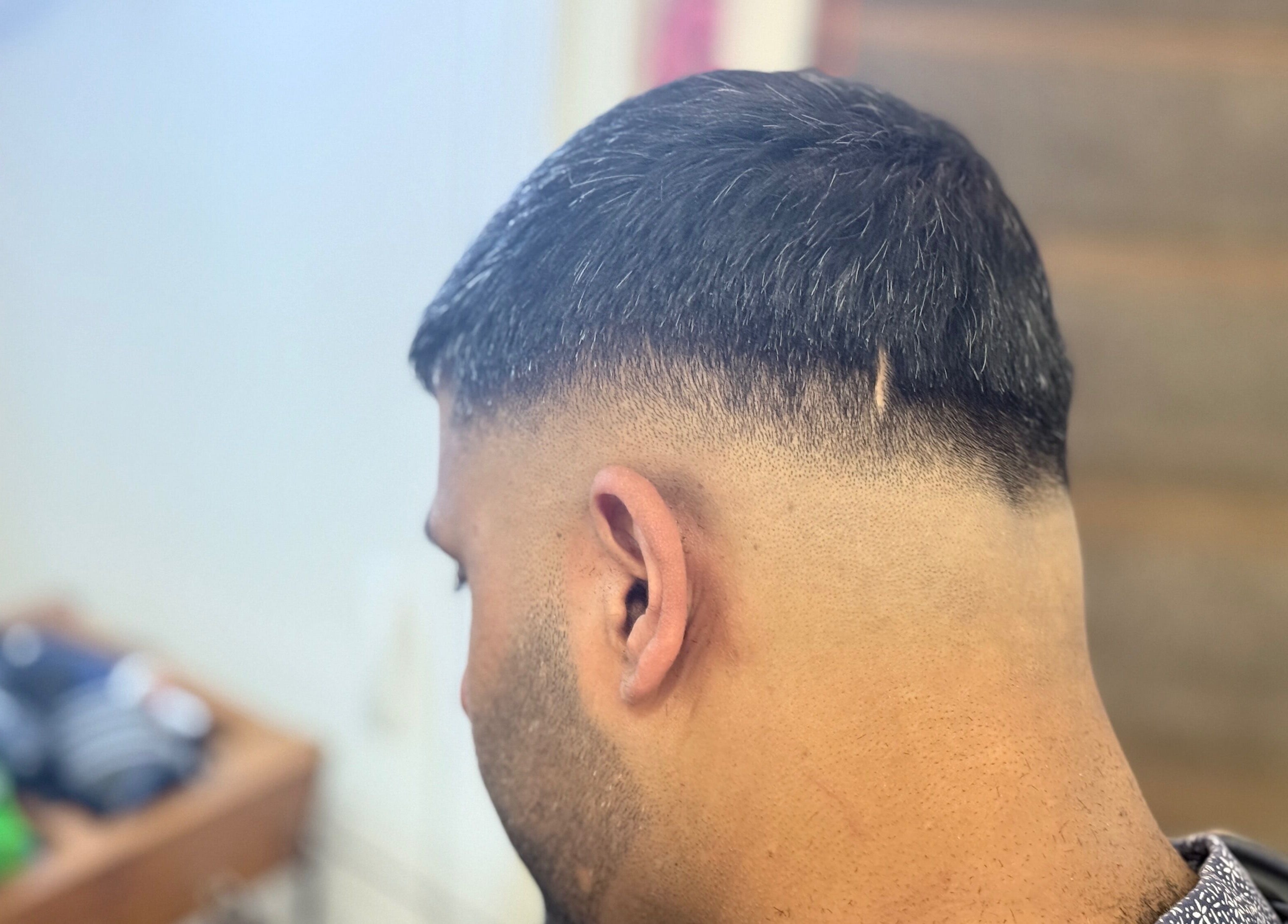 Close-up of a sharp fade haircut from FadeLinez (Peterborough Mobile Barber), Peterborough, England, GB.