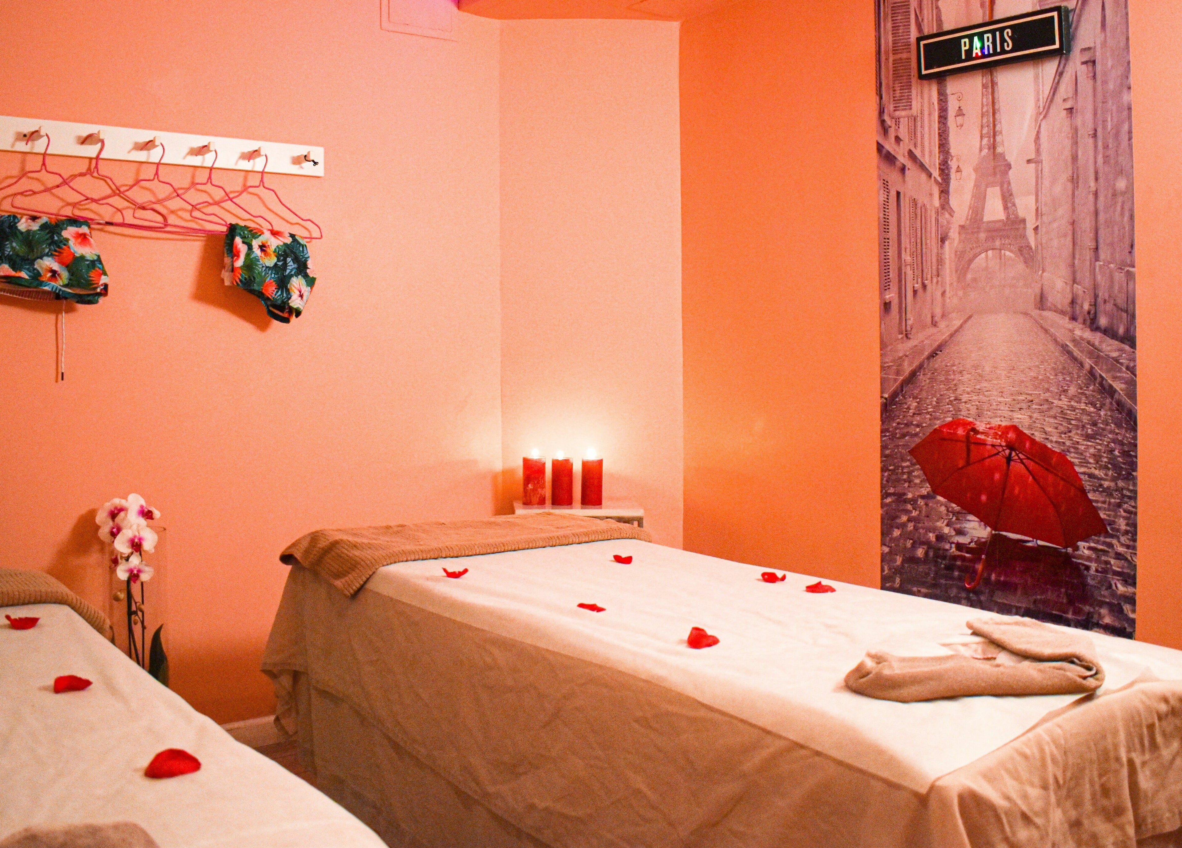 Relaxing spa room at The Couple Spa in New York, New York, US with warm lighting and rose petals.