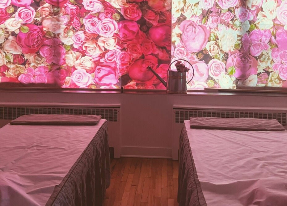 Serene massage room with floral decor at The Couple Spa, New York, New York, US.