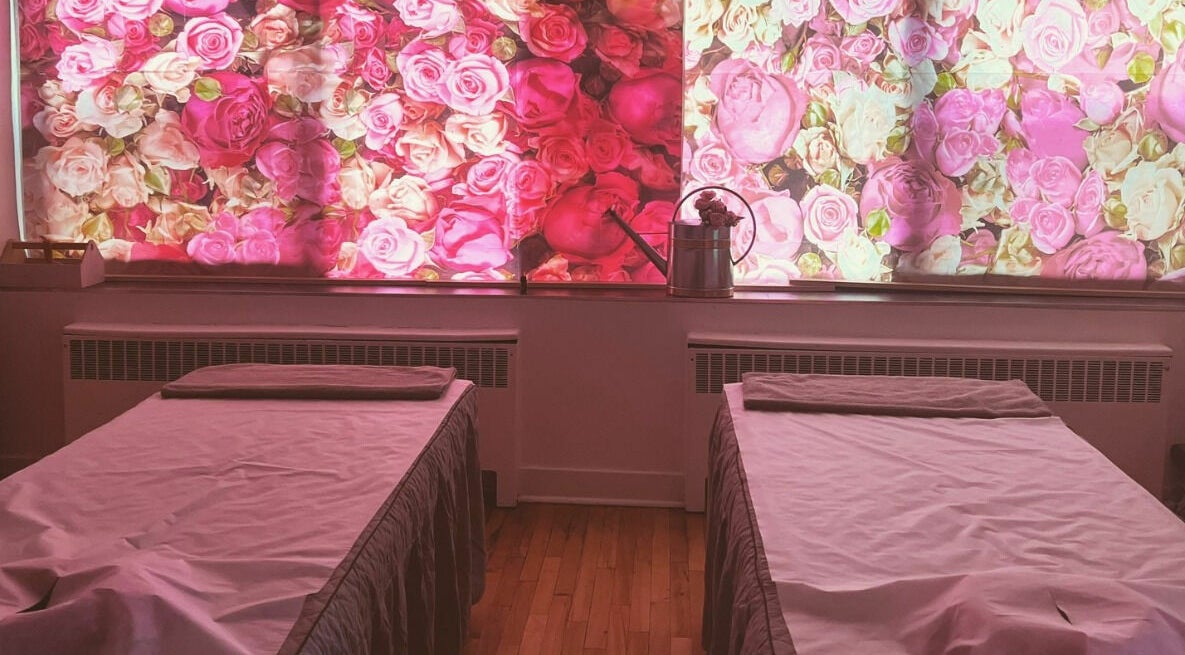 Serene massage room with floral decor at The Couple Spa, New York, New York, US.