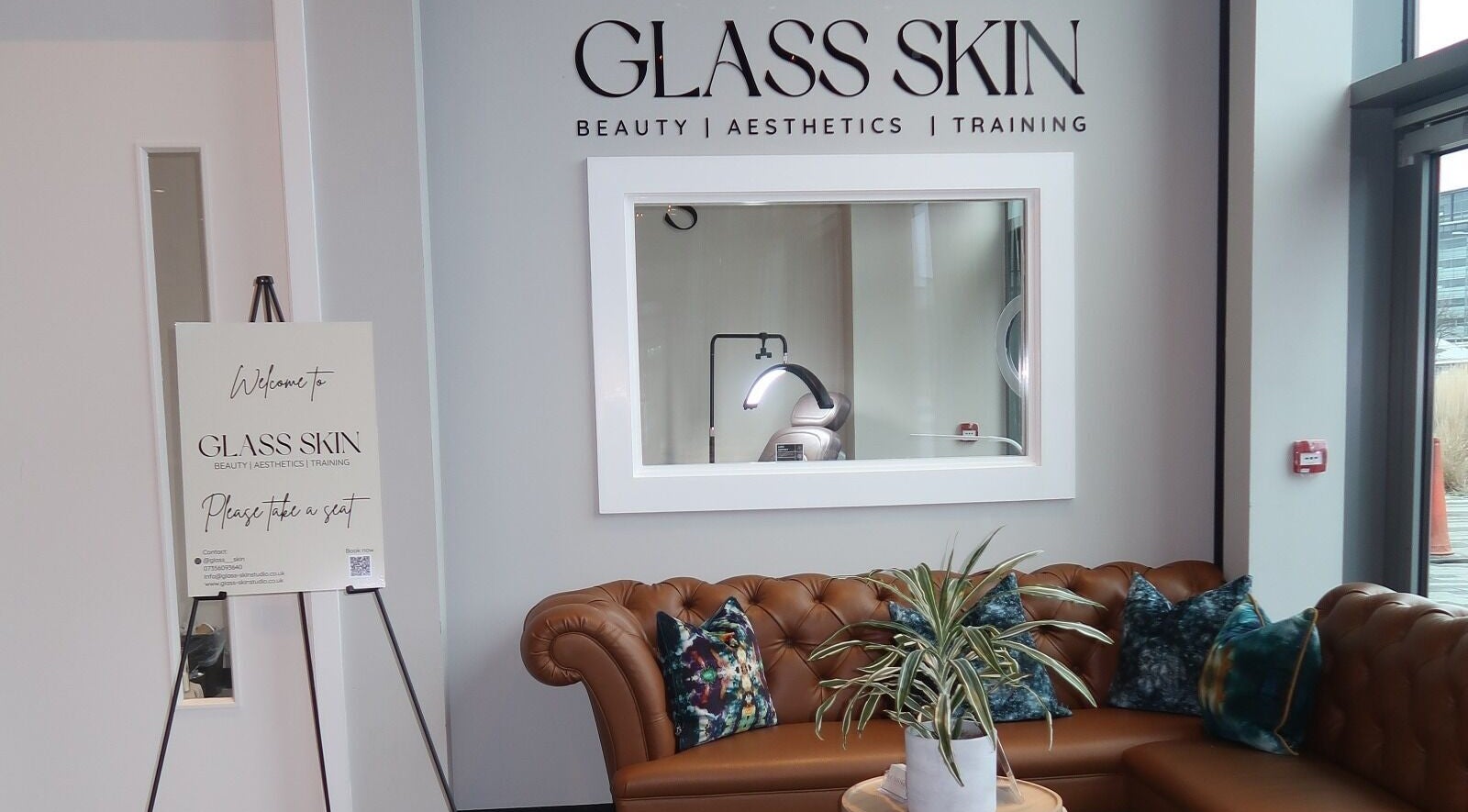 Welcoming lounge with chic decor at Glass Skin Studio, Glasgow, Scotland, GB.