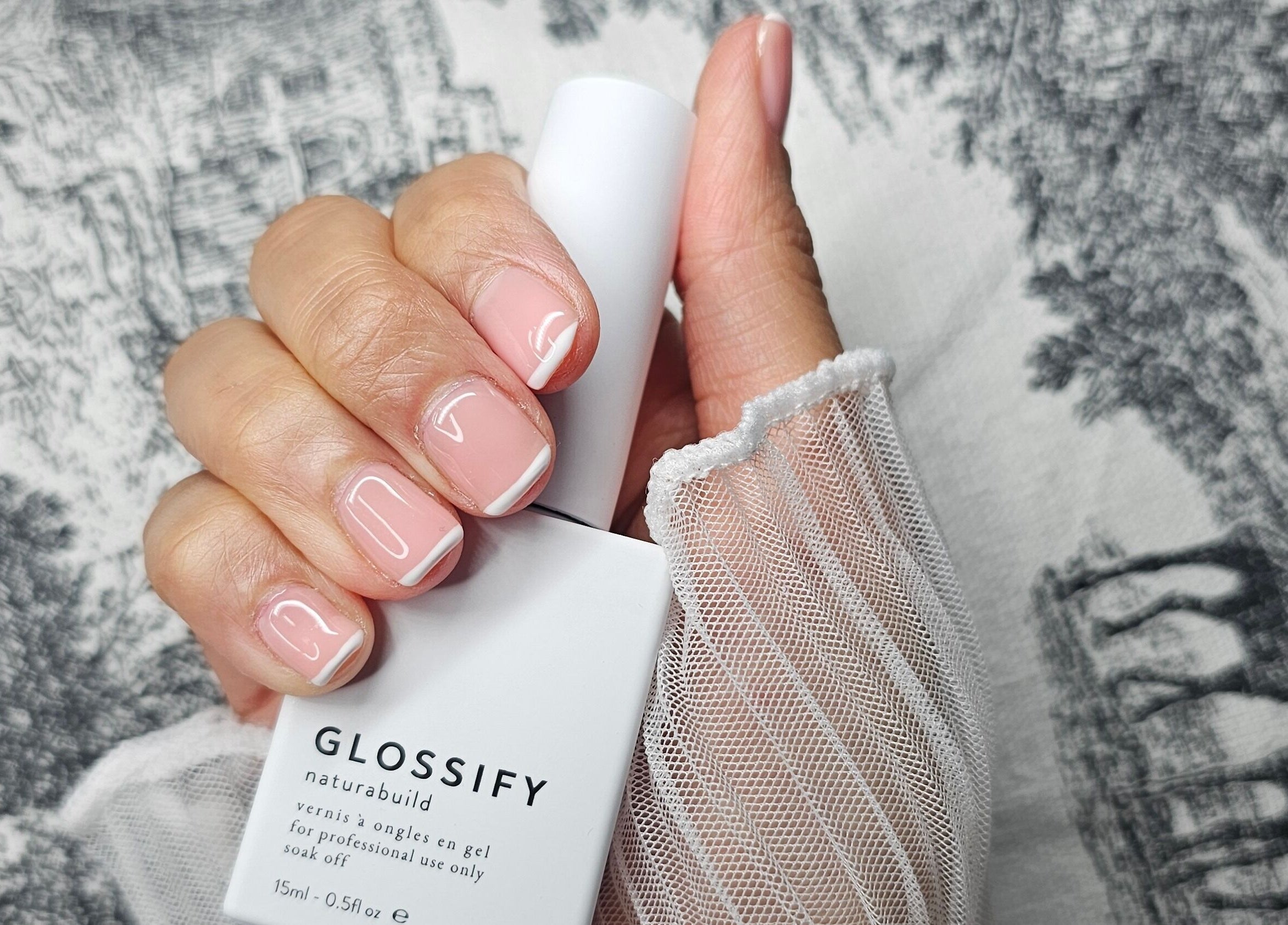 French manicure at Glass Skin Studio, Glasgow, Scotland, GB, showcasing glossy pink and white nails.