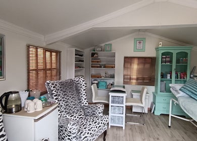 Relaxing spa room at Arjay Beauty Lounge, Pretoria, Gauteng, ZA, with plush seating and soothing decor.