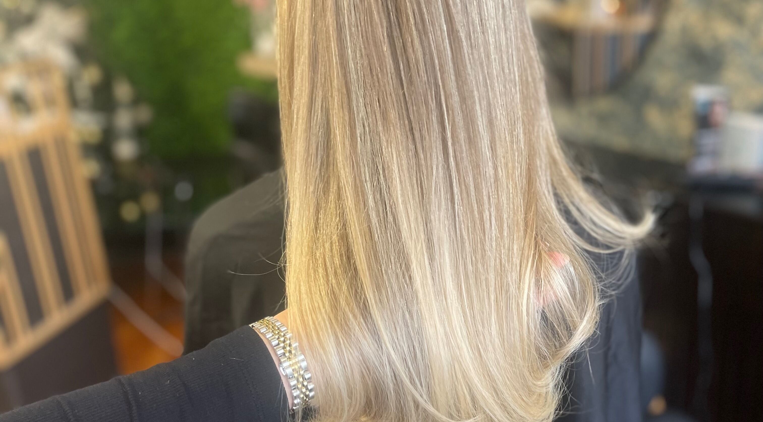 Beautiful blonde hair styled at Fliss Hair, Hindley, England, GB, showcasing silky smoothness and shine.