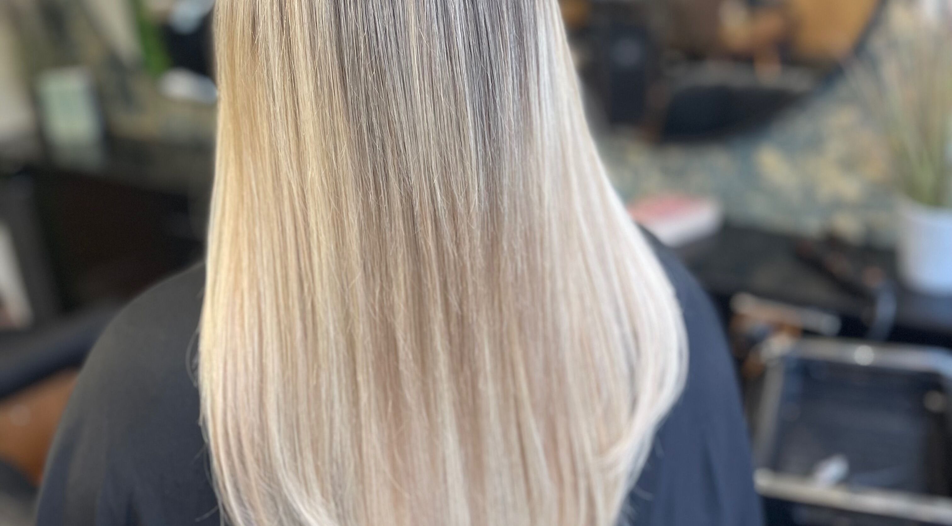 View of sleek, straight blonde hair at Fliss Hair, Hindley, England, GB, showcasing expert styling.