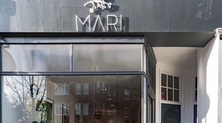 Front of Salon Mari Chiswick, a stylish beauty venue in London, England, GB with elegant signage.