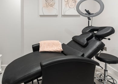 Elegant treatment room at Salon Mari Chiswick in London, England, GB, featuring a plush spa chair and serene decor.