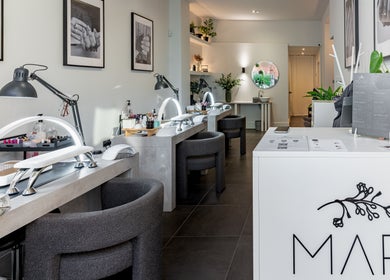Modern nail bar at Salon Mari Chiswick, London, England, GB, showcasing sleek design and manicuring stations.