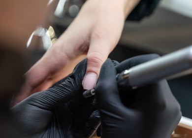 Expert nail care at Salon Mari Chiswick, London, England, GB. Hands receiving a precise manicure.