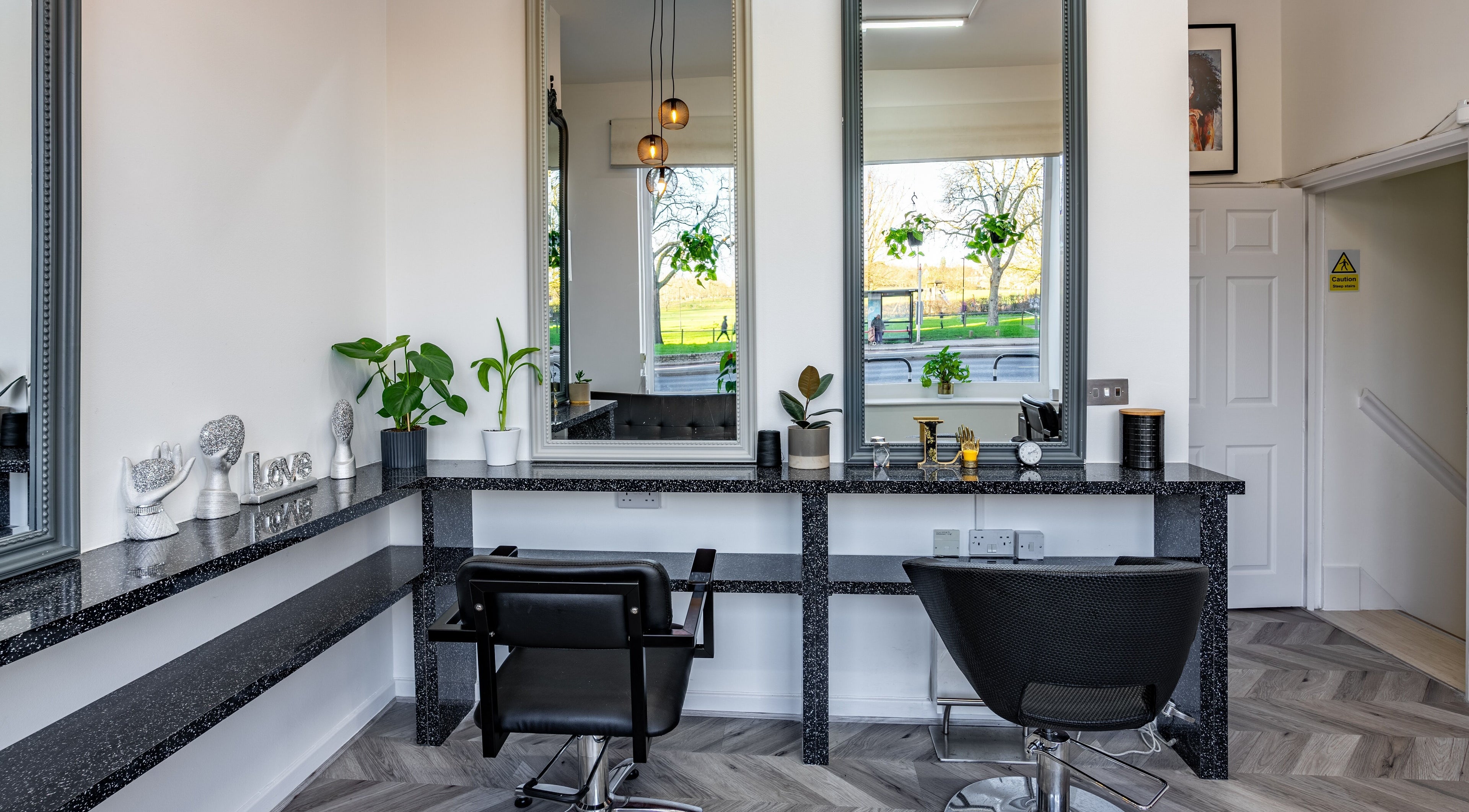 Modern salon interior at Always Natural, London, England, GB with stylish decor and large mirrors.