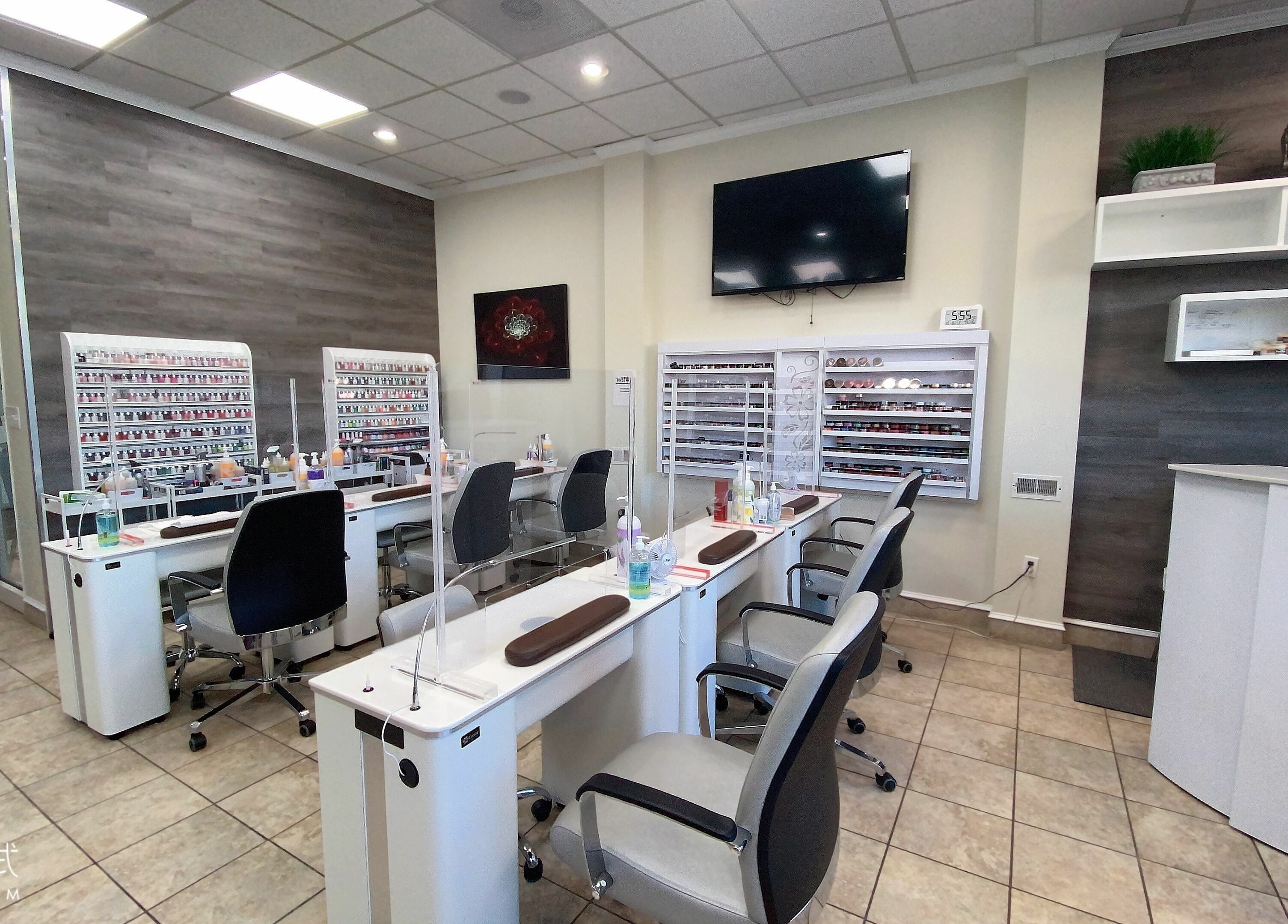 Modern manicure stations at Avalon Nails and Spa, Silver Spring, Maryland, US, featuring sleek design and nail products.