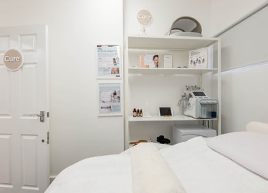 Treatment room at The Cure Clinic, London, England, GB with equipment and cozy bedding.