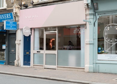 The Cure Clinic exterior in London, England, GB showcasing modern storefront design.