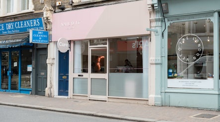 The Cure Clinic exterior in London, England, GB showcasing modern storefront design.