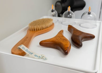 Massage tools and dry brush at The Cure Clinic in London, England, GB enhance relaxation and wellness.
