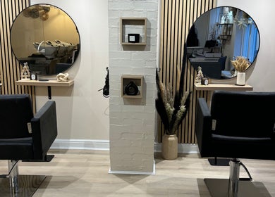 Chic salon interior with stylish chairs at Ludlow Hairitage & Beauty Room, Ludlow, England, GB.