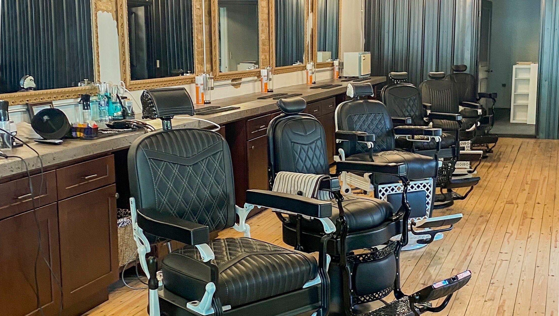 Sleek barber chairs at Public Square Barbers, Gallatin, Tennessee, US, showcasing a professional styling atmosphere.