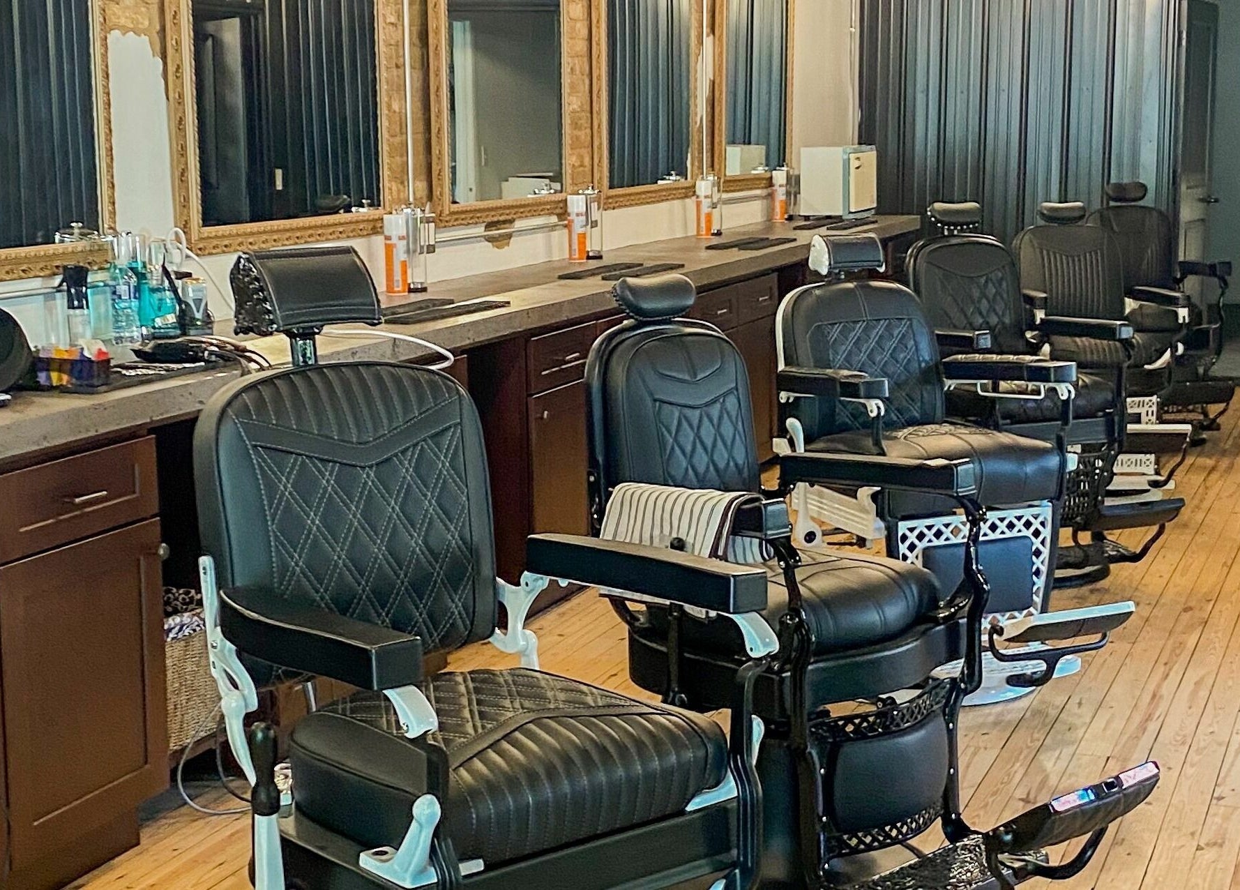 Sleek barber chairs at Public Square Barbers, Gallatin, Tennessee, US, showcasing a professional styling atmosphere.