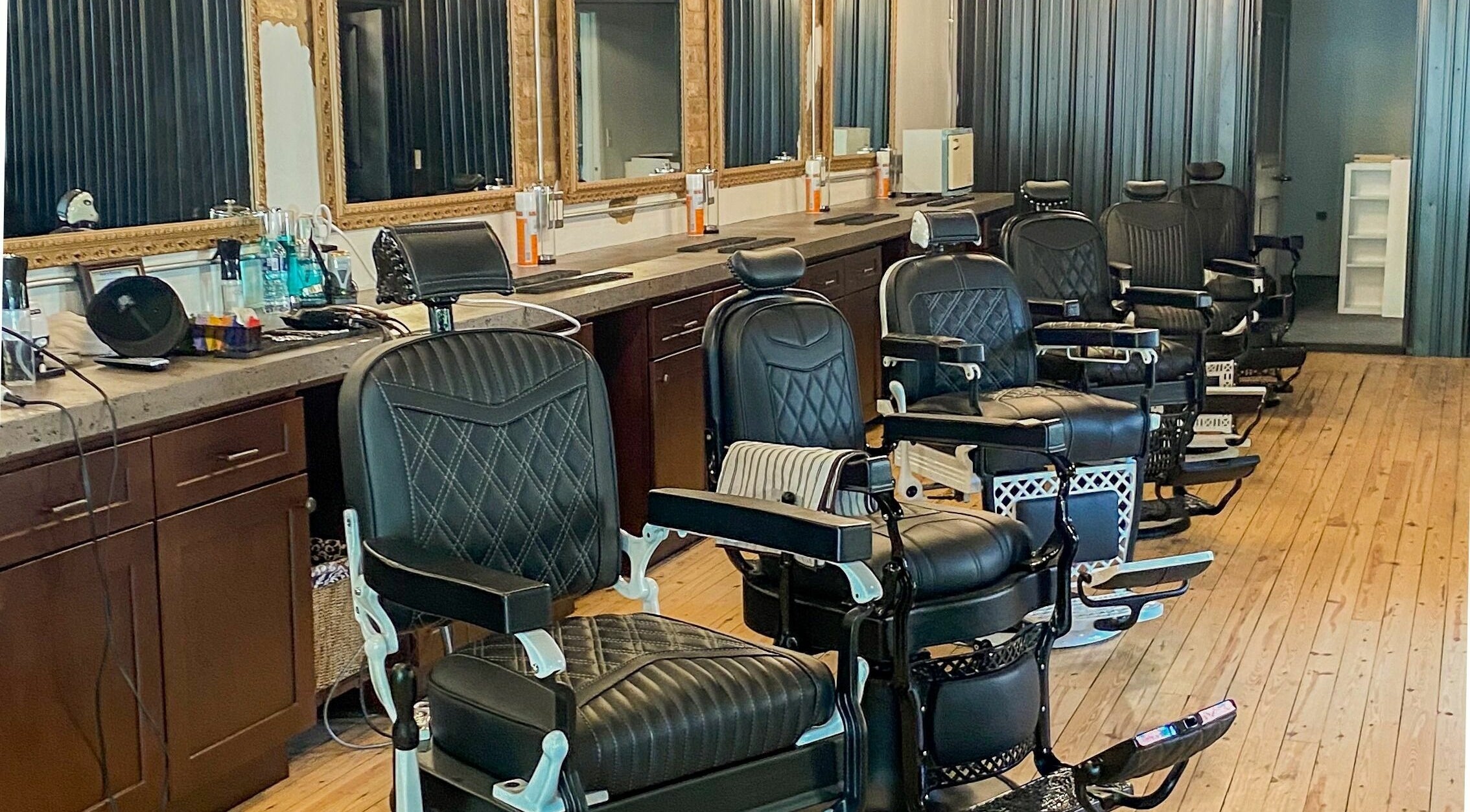 Sleek barber chairs at Public Square Barbers, Gallatin, Tennessee, US, showcasing a professional styling atmosphere.