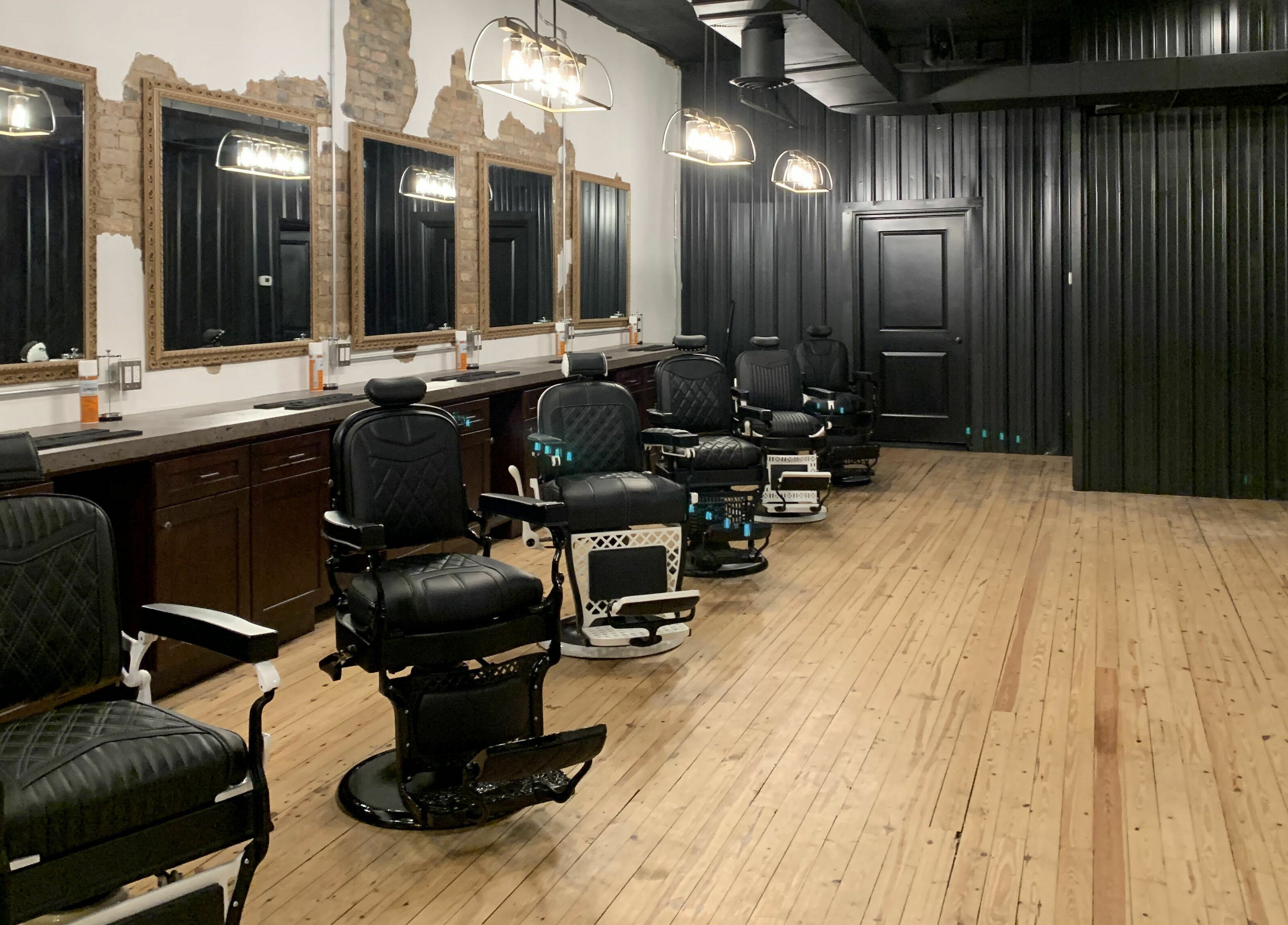 Stylish barber chairs at Public Square Barbers, Gallatin, Tennessee, US, showcasing modern interior design.