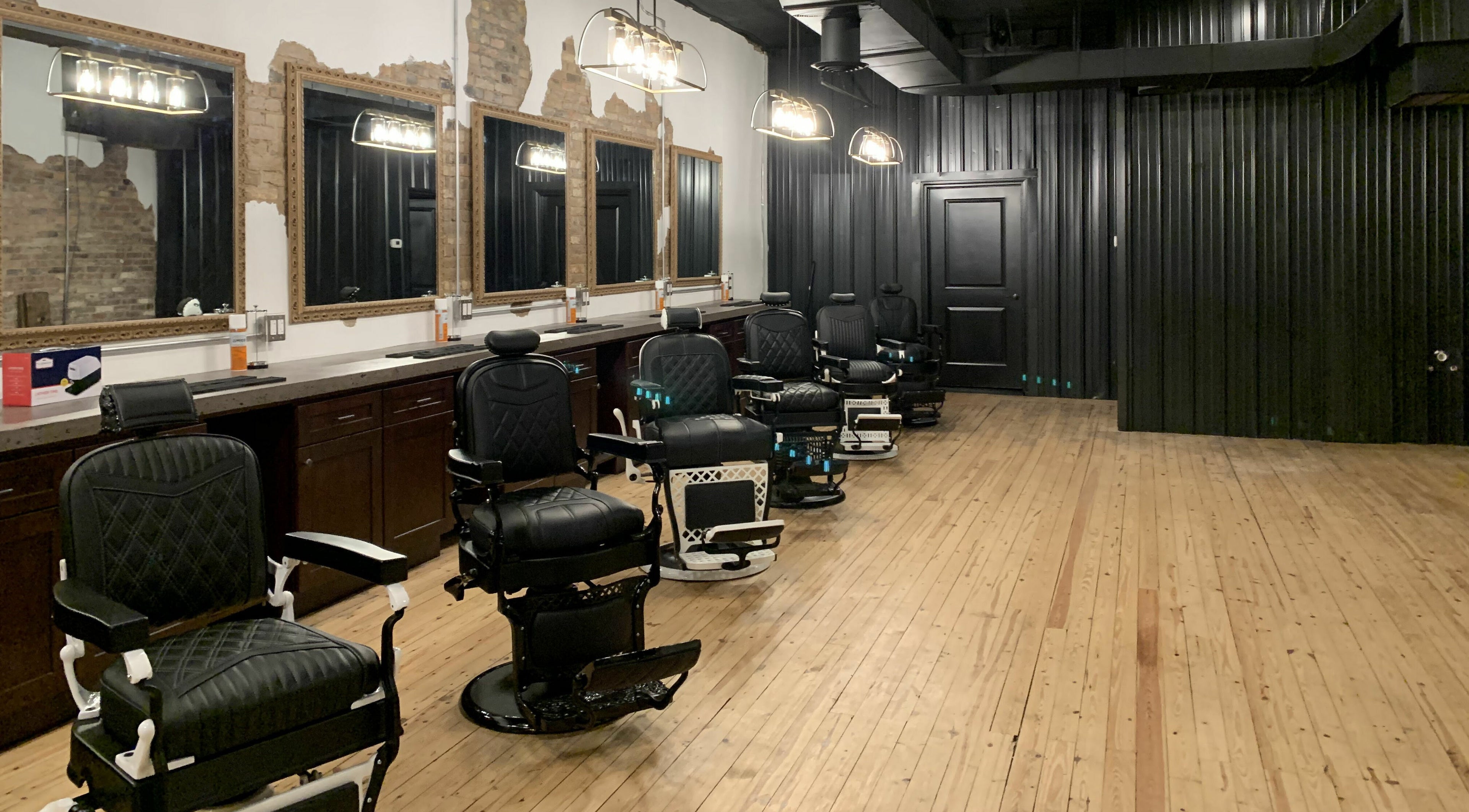 Stylish barber chairs at Public Square Barbers, Gallatin, Tennessee, US, showcasing modern interior design.