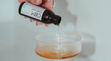 High gloss liquid being poured at KG Hair Artistry, Bunbury, WA, AU for styling treatment.