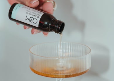 Hair product being poured into a glass at Lush Lane Hair Lounge, Bunbury, WA, AU.