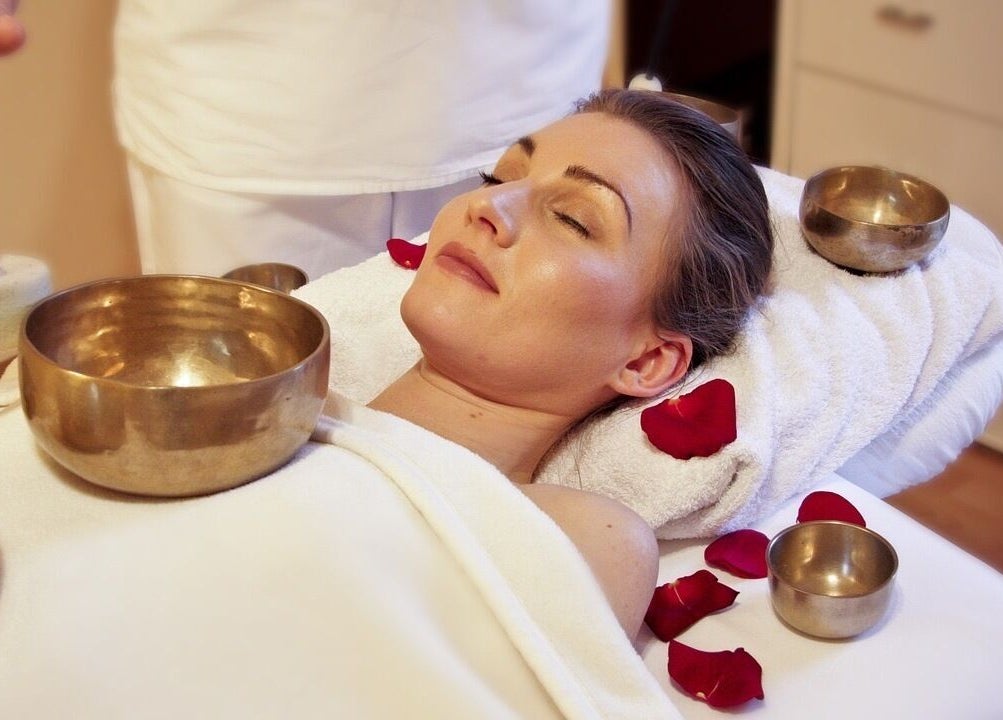 Sound therapy session at Wellbeing and Healing with Lisa in Birkenhead, England, GB with singing bowls.