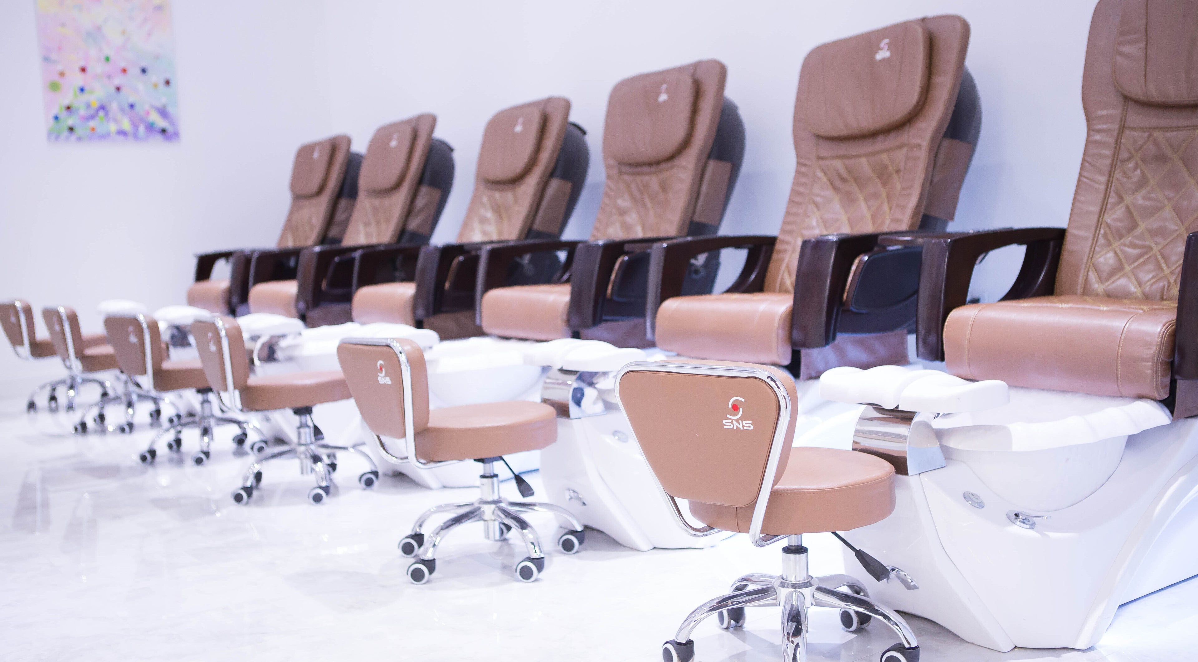 Chic pedicure chairs at Ava Nail and Lash Spa (Orlando), Orlando, Florida, US ensure a relaxing experience.