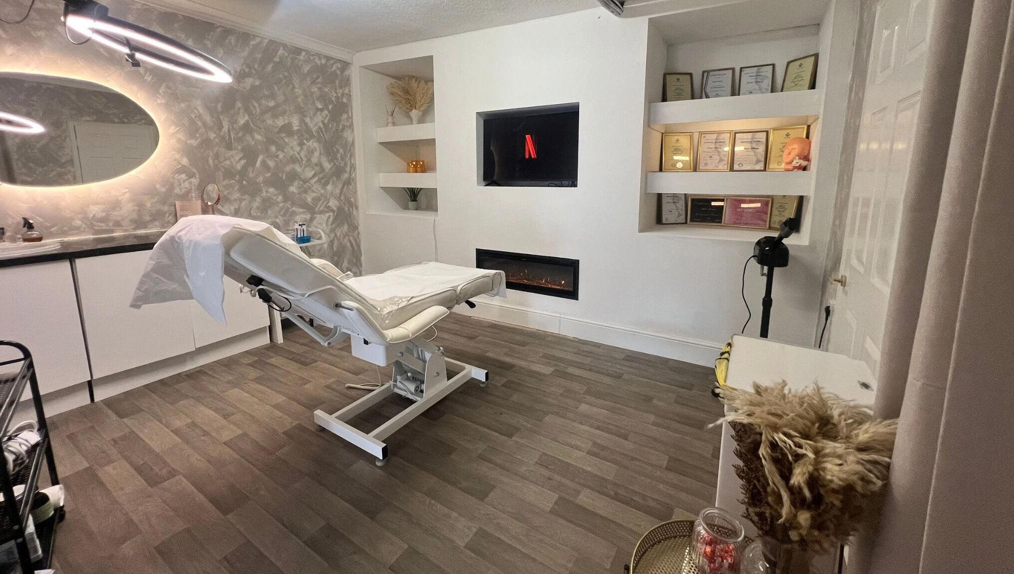 Chic treatment room at Airbrushed Aesthetics, Spalding, England, GB featuring modern decor and treatment bed.