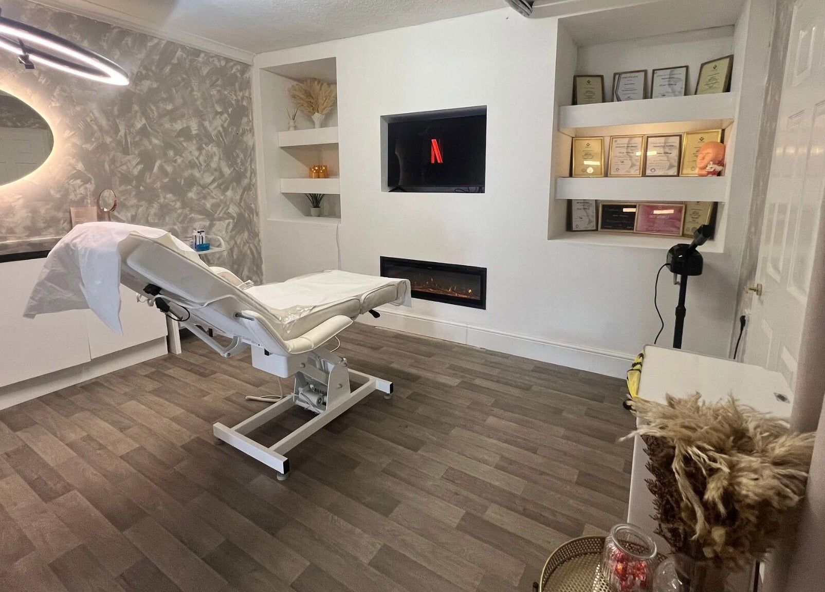 Chic treatment room at Airbrushed Aesthetics, Spalding, England, GB featuring modern decor and treatment bed.
