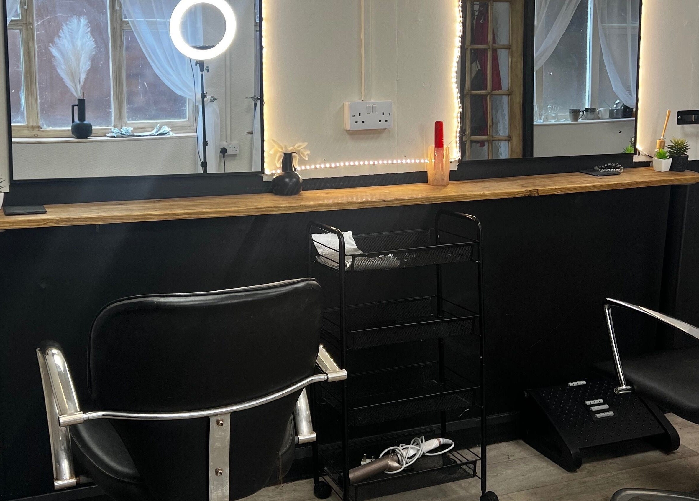 Elegant beauty station at Airbrushed Aesthetics, Spalding, England, GB with chair and lighting.