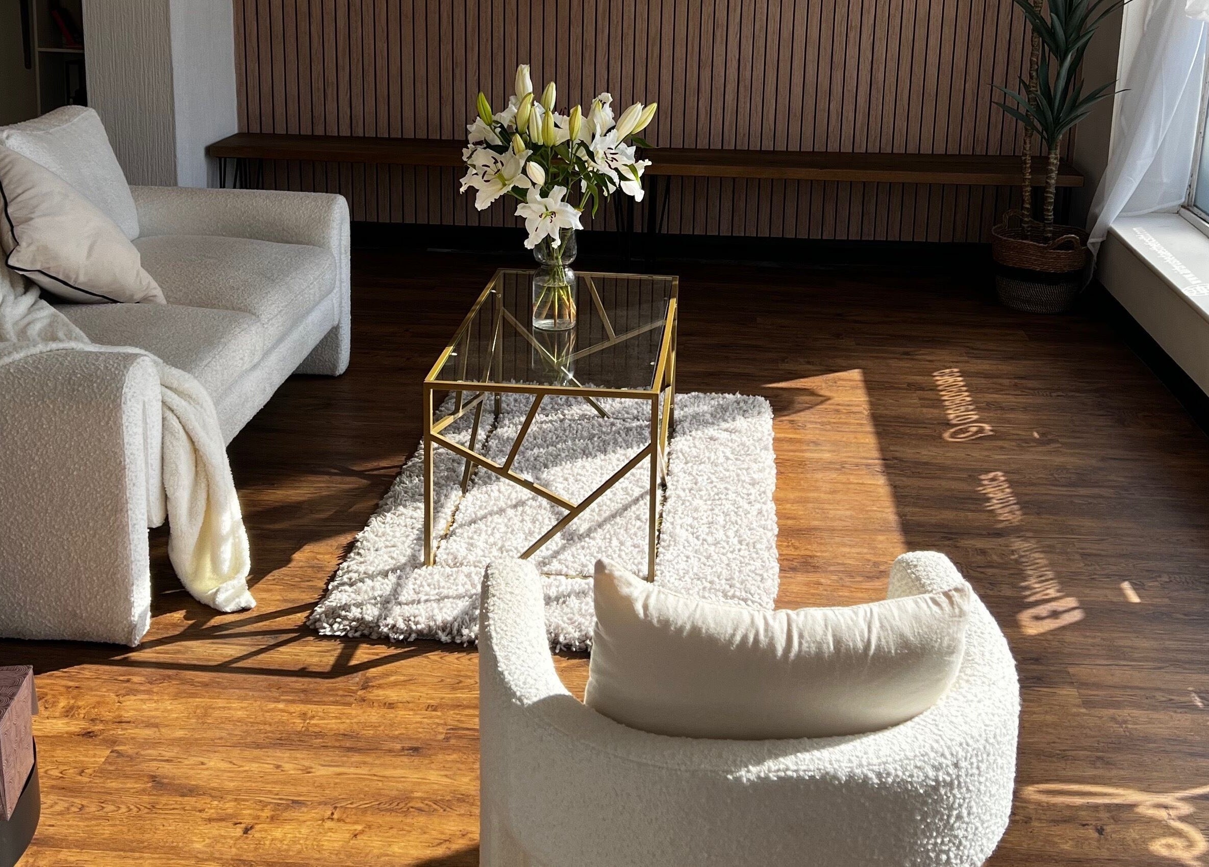 Elegant seating area at Airbrushed Aesthetics, Spalding, England, GB, with cozy chairs and floral decor.