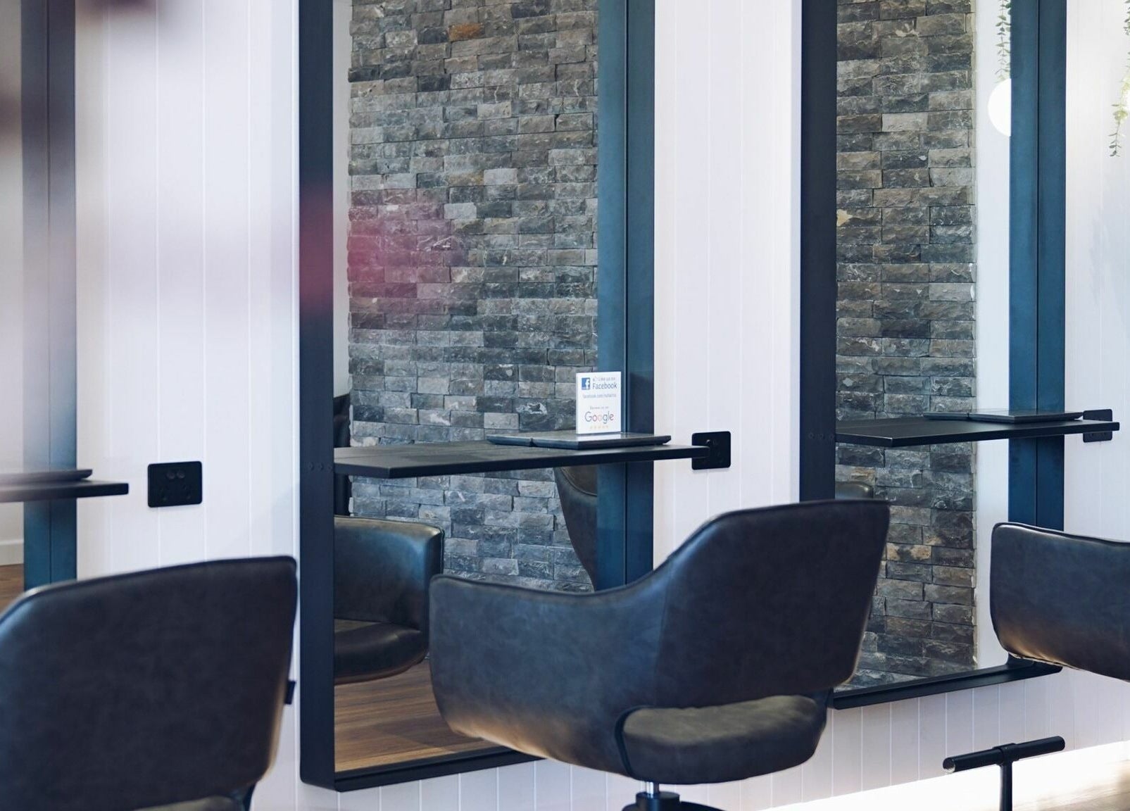 Modern salon interior at NUHAIRCO, Mount Claremont, AU showcasing stylish chairs and mirrors.