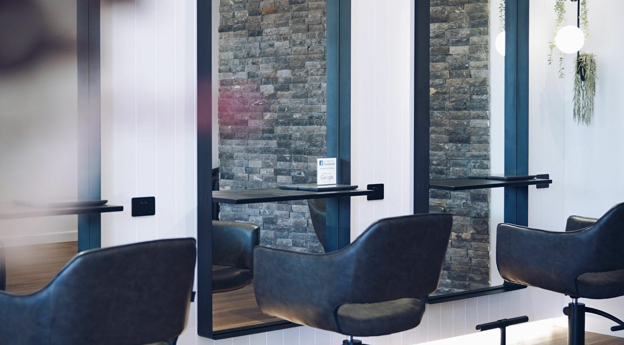 Modern salon interior at NUHAIRCO, Mount Claremont, AU showcasing stylish chairs and mirrors.