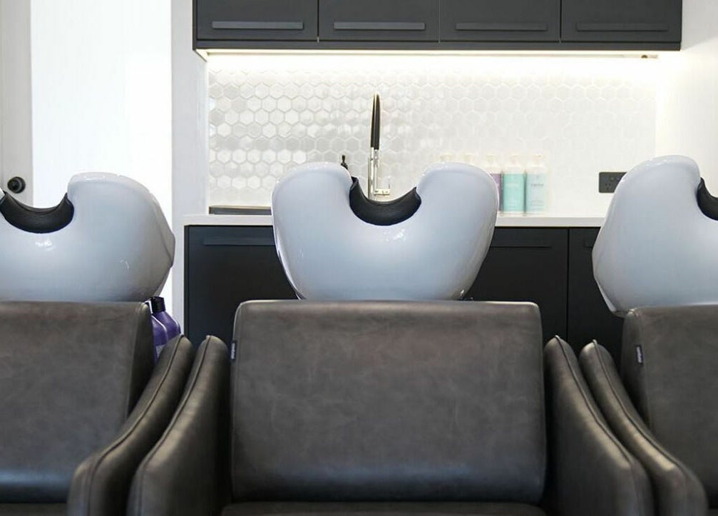 Luxurious salon wash stations at NUHAIRCO, Mount Claremont, AU, showcasing comfort and style.