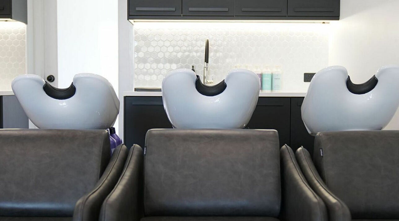 Luxurious salon wash stations at NUHAIRCO, Mount Claremont, AU, showcasing comfort and style.