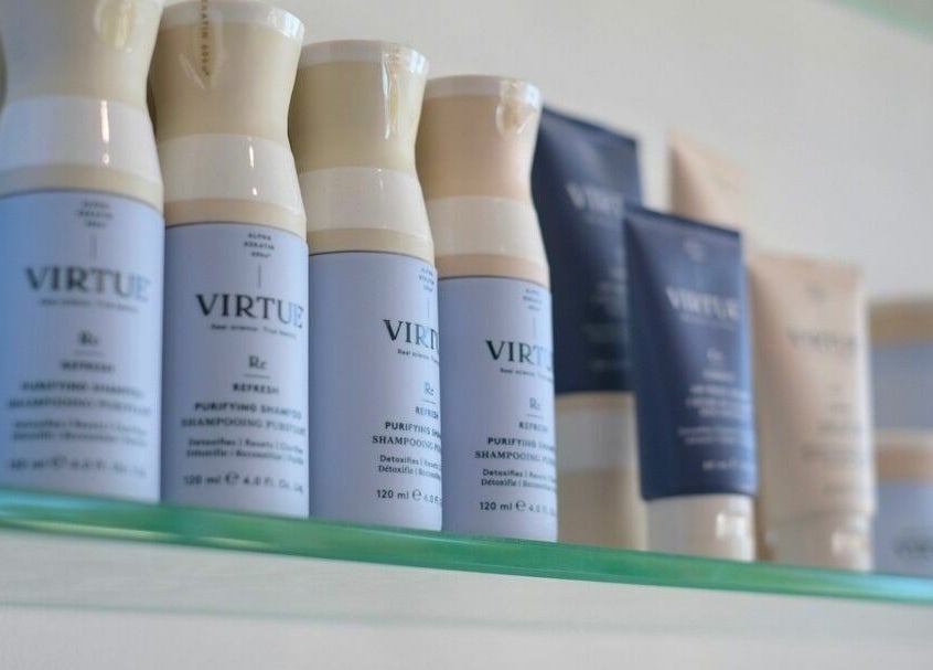 Virtue haircare products on a shelf at NUHAIRCO, Mount Claremont, AU, offering premium beauty solutions.